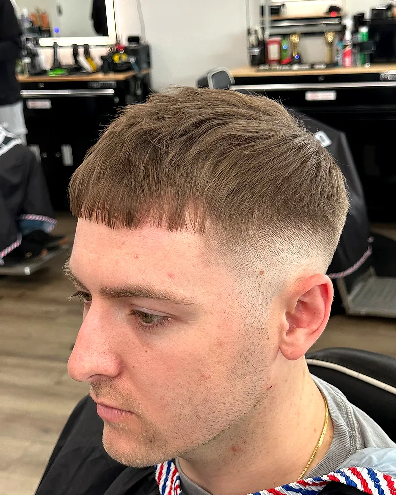 Clean tapered fade with a textured top
